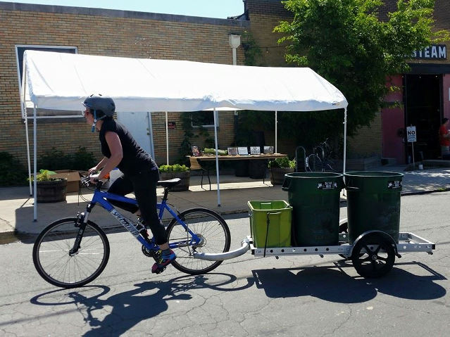 Tilthy Rich rider and trailer in front of display